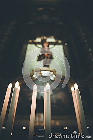 Awestruck catholic church in Italy with electric candles Stock Photo