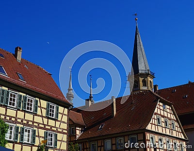 Historic Center of Weikersheim with church steeples and fachwerk buildings. Stock Photo