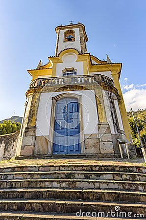 Historic church with its stairs, bell and tower in the city of Ouro Preto Stock Photo