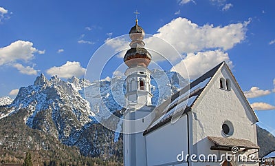 Historic church mittenwald and karwendel mountains Stock Photo