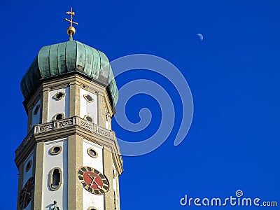 Church tower with onion dome and belfry in rich blue sky Stock Photo