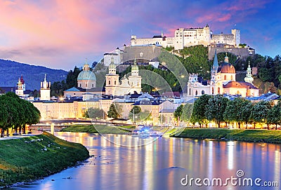 Historic city of Salzburg with Hohensalzburg Fortress at dusk, S Stock Photo
