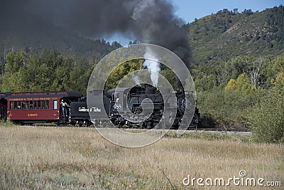 Historic Cumbres Toltec narrow-gauge train steam engine enroute to Antonito, Colorado train station Editorial Stock Photo