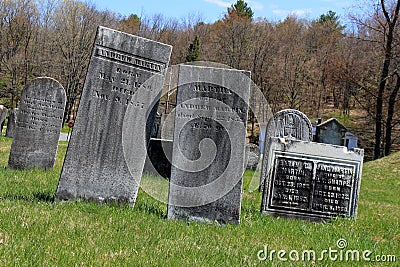 Historic gravestones in grass and hilly landscape, The Revolutionary Cemetery, Salem, New York, 2016 Editorial Stock Photo