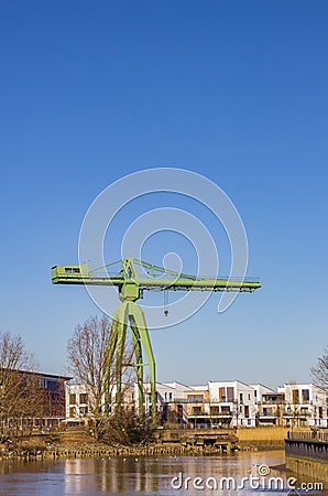 Historic green crane at the Geeste river in Bremerhaven Stock Photo