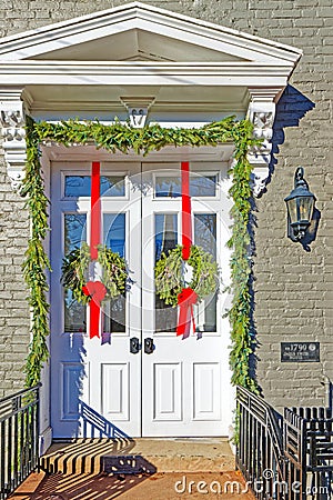 historic home dated 1790 in Stockade Historic District decorated for Christmas Editorial Stock Photo
