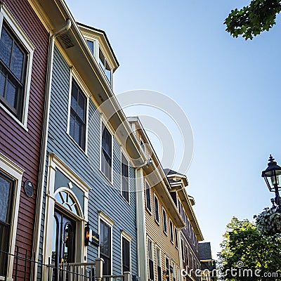 Historic hotel with colorful houses in Charlottetown, Prince Edward Island, Canada Stock Photo