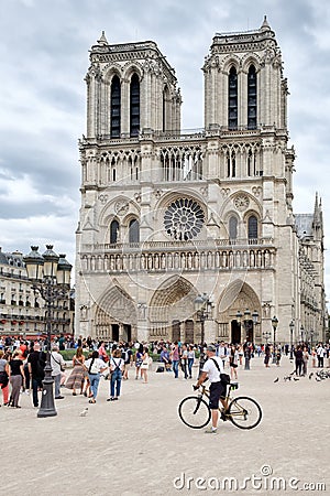 The historic Notre Dame Cathedral in Paris on a cloudy day Editorial Stock Photo