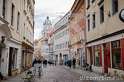 Historic picturesque renaissance house on the streets of old town, bell tower of Frauenkirche, Church of Our Lady, Christmas Editorial Stock Photo