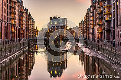 The historic Speicherstadt with the Wasserschloss Stock Photo