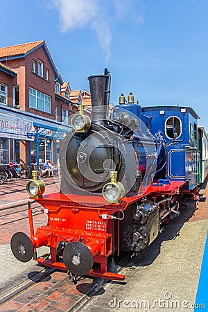Historic steam train locomotive in the center of Borkum village Editorial Stock Photo