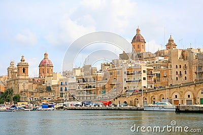 Historic stone buildings by harbour Editorial Stock Photo