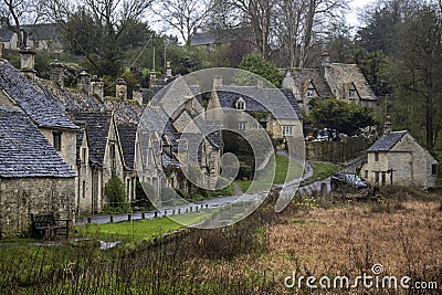 The historic stone cottages of Arlington Row in Bibury, Gloucestershire Editorial Stock Photo