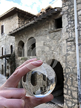 Glass ball and old stone house view Stock Photo