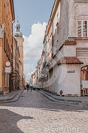 Historic street with old tenement houses in the Warsaw Old Town in Poland on a summer day Editorial Stock Photo