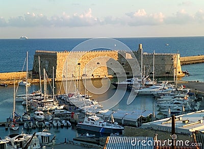 The Historic Venetian Fortress Castello a Mare in the Morning Sunlight, Old Port of Heracleion, Crete Island Editorial Stock Photo