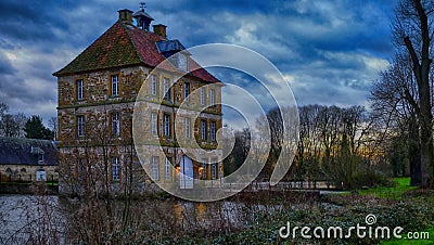 Historic Water Castle `Schloss Tatenhausen` in Kreis Guetersloh, North Rhine-Westphalia, Germany Stock Photo