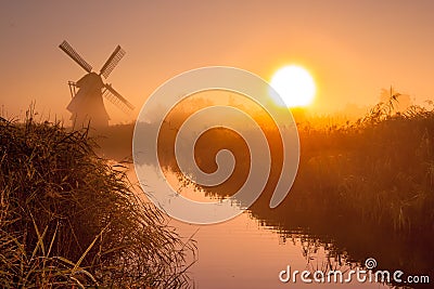 historic windmill in a polder Stock Photo