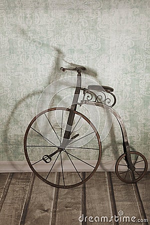 Historical bicycle by the wall Stock Photo