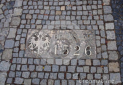 Historical bronze plaques with important dates on passway. Old town, Wroclaw. Poland Editorial Stock Photo