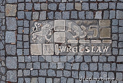 Historical bronze plaques with important dates on passway. Old town, Wroclaw. Poland Editorial Stock Photo