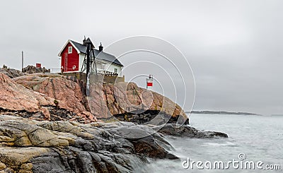 Historical building and small lighthouse in the area of FemÃ¶re, Sweden Stock Photo