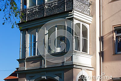 historical city facades with windows balcony doors Stock Photo