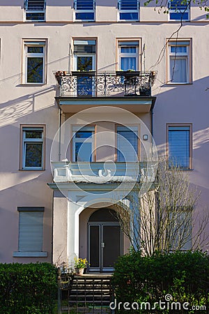 historical city facades with windows balcony doors Stock Photo