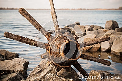 Historical find in the river - an old wheel from a horse-drawn cart Stock Photo