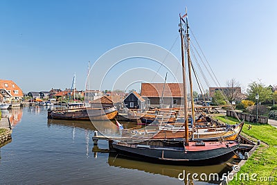 Historical fishing vessels anchored in harbor Dutch fishing village Workum Editorial Stock Photo