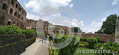 Historical Golconda fort with beautiful greenery and background of shiney white clouds Editorial Stock Photo