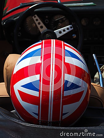 Historical Gran Prix. Helmet with English flag in a historic car Editorial Stock Photo