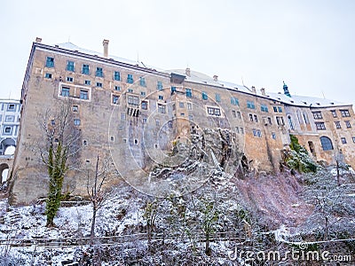 Historical houses and castle landmark statue river winter season snow in Cesky Krumlov. Czech Republic Stock Photo