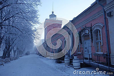 Historical jetty barracks and clock tower on cold winter morning in Suomenlinna fortress island. Editorial Stock Photo