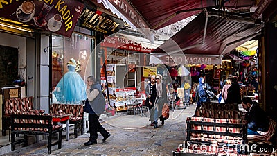 Historical Kemeralti Market in Izmir, Turkey.People drink traditional Turkish coffee and relax in the cafes in the historic bazaar Editorial Stock Photo