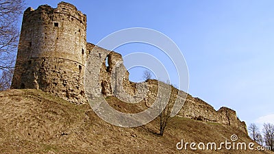 Historical monument. View of the stone walls and towers of the ancient fortress of Koporye. Russia. Stock Photo