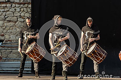 Boys with medieval costumes playing drums Editorial Stock Photo