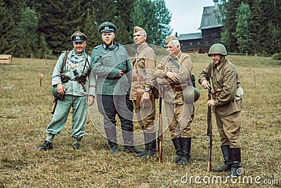 Historical reconstruction second world war. Soldiers posing at t Editorial Stock Photo