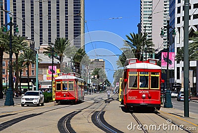 Historical Red Street Cars on Canal Street, New Orleans, Louisiana Editorial Stock Photo