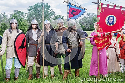 Historical reenactors in suits and with weapons in the ranks Editorial Stock Photo