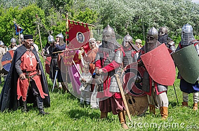 Historical reenactors in suits and with weapons in the ranks Editorial Stock Photo