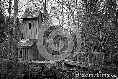 Historical Sheave Tower in the Woods BW Stock Photo