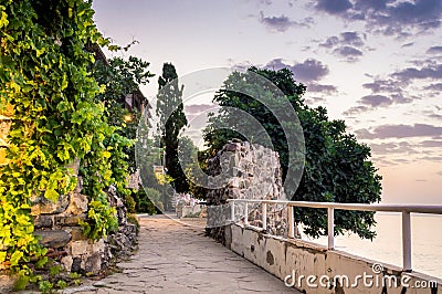 Historical southern walls over the Black sea cove in Sozopol, Bulgaria, Europe at dusk. Stock Photo