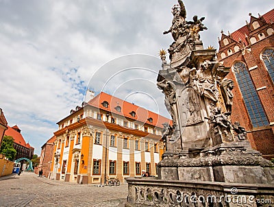 Historical statue with angels near the churches of the old polish city Editorial Stock Photo