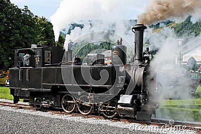 Historical steam engine on tracks Stock Photo