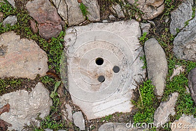 Historical stone manhole Stock Photo