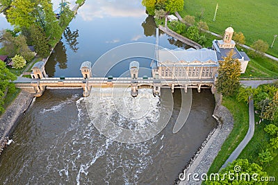 Historical water power plant building with the weir on the Labe River lock in Podebrady, Czech Republic. Aerial view on Old lock c Stock Photo