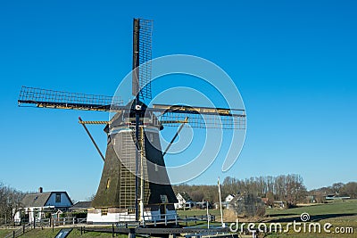 Historical wind mill in a rural landscape Stock Photo