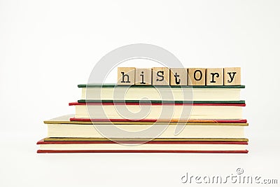 History word on wood stamps and books Stock Photo