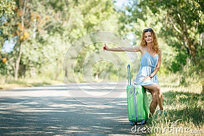 Hitchhiking girl looking for adventures Stock Photo